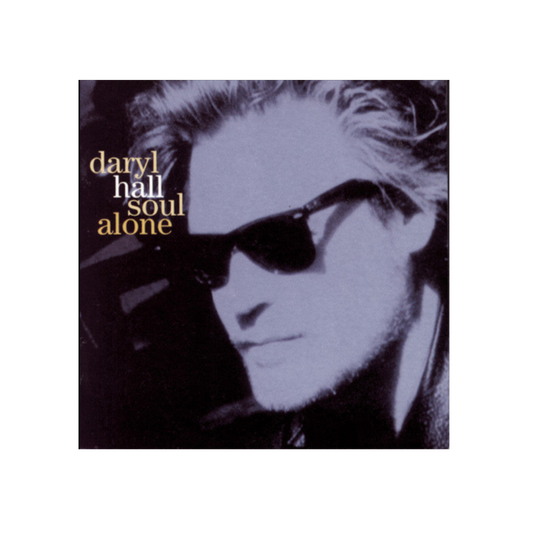 Album cover for Daryl Hall's 'Soul Alone' featuring a stylized black and white portrait of the artist wearing sunglasses, with the title and artist name printed in gold text on the left.