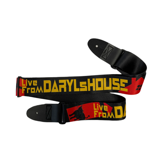 A black, red, and yellow guitar strap with text 'LIVE FROM DARYL'S HOUSE' on the strap body, laid out flat.